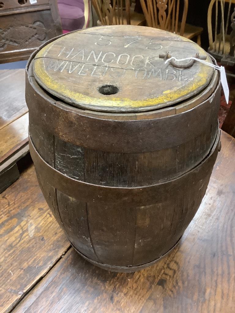 Breweriana: A small Somerset oak coopered barrel with cover, the lid inscribed ‘575 Hancock Wiveliscombe’, William Hancock & Sons (Wiveliscombe) Ltd, 44cm high, 19th century, 30cm diameter, height 42cm